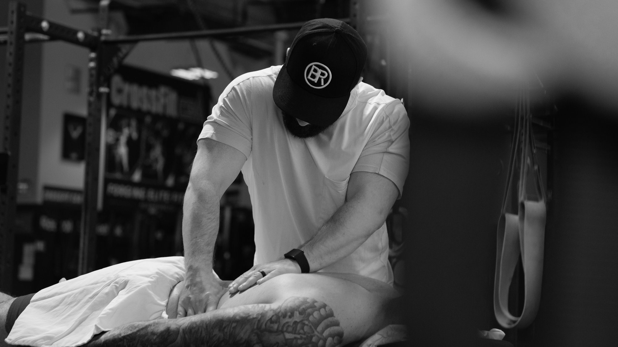 Physical therapist providing targeted low back massage for pain relief