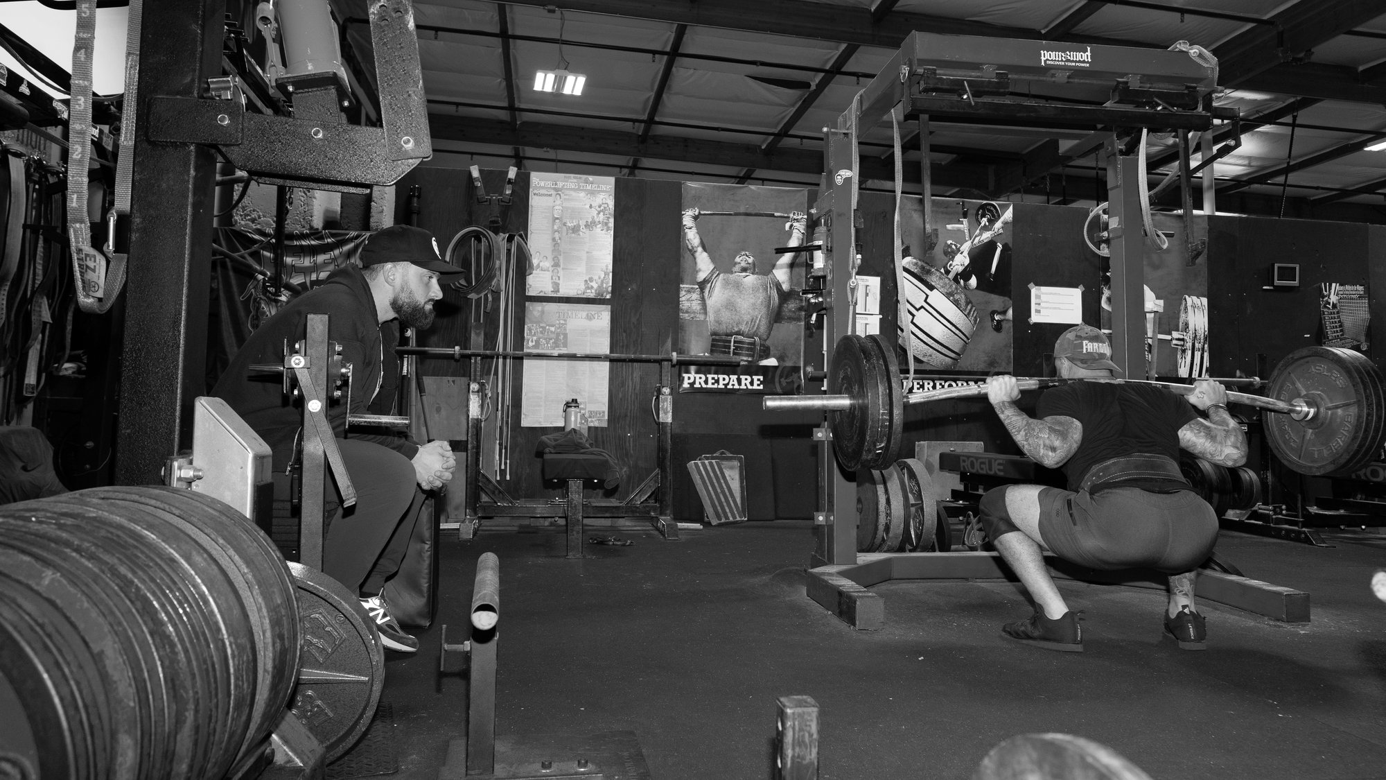 Dr Rob Physical Therapist evaluating barbell squat