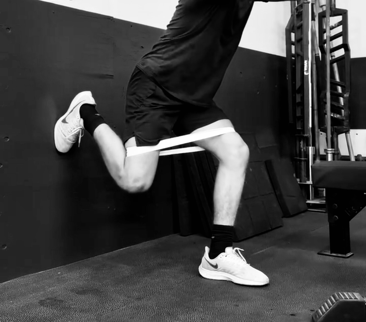 Athlete performing standing hip stability exercises at Bax Performance and Rehab in Pleasanton, CA as a progression beyond clamshells for stronger, pain-free movement.
